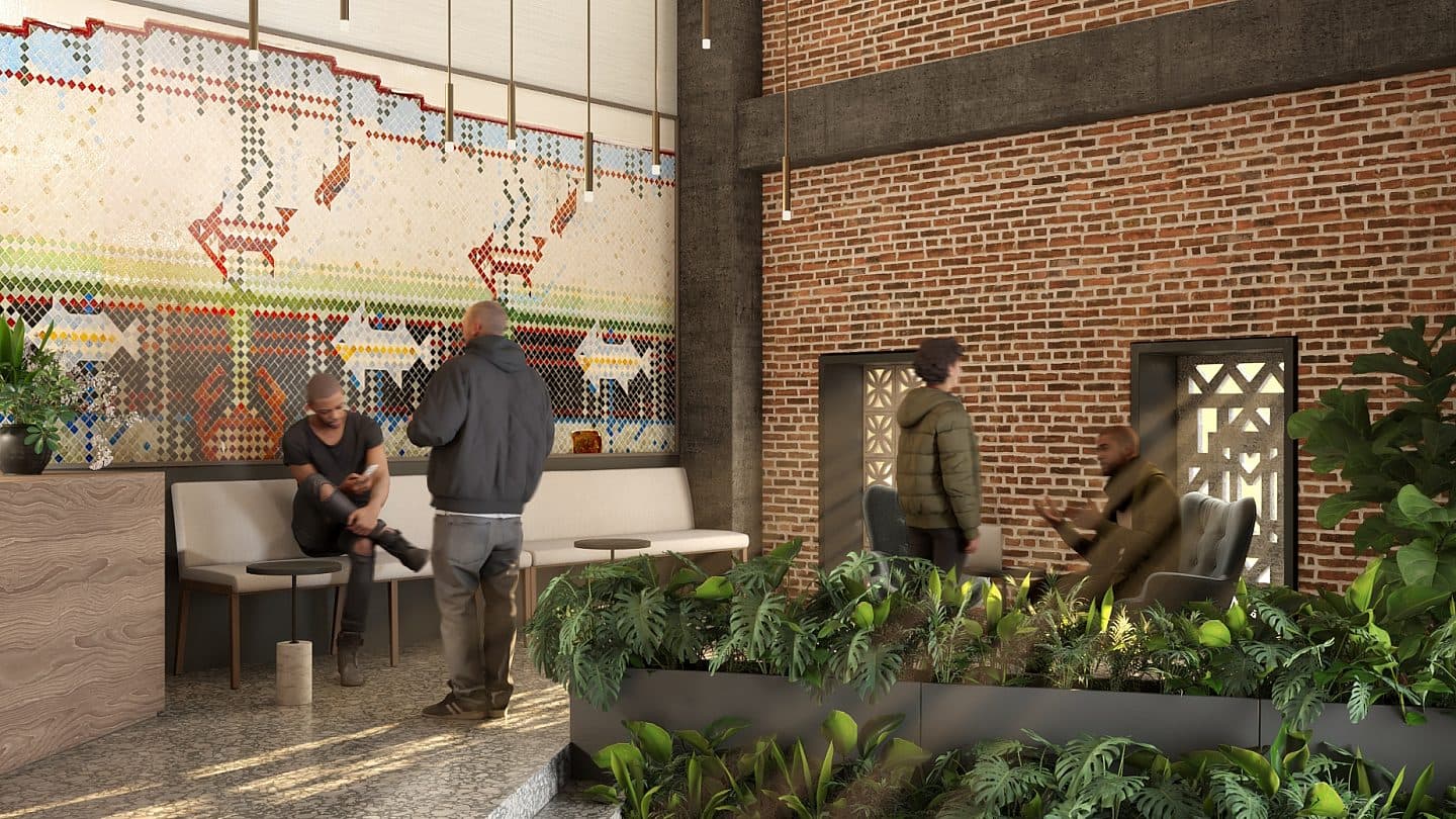 The lobby displays two people siting down and interacting with a standing person.