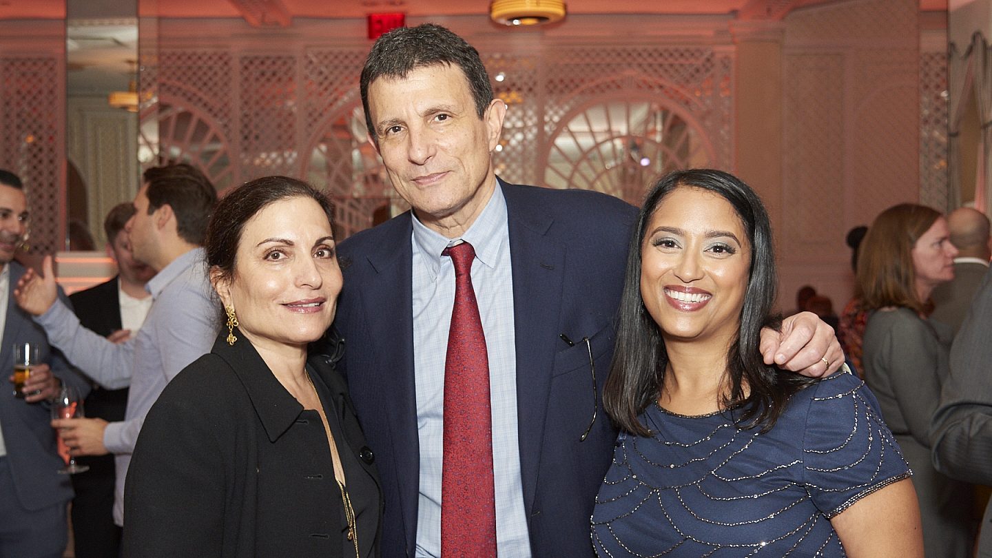 Esther Fein, David Remnick, Archana Jayaram standing together smiling at the camera.