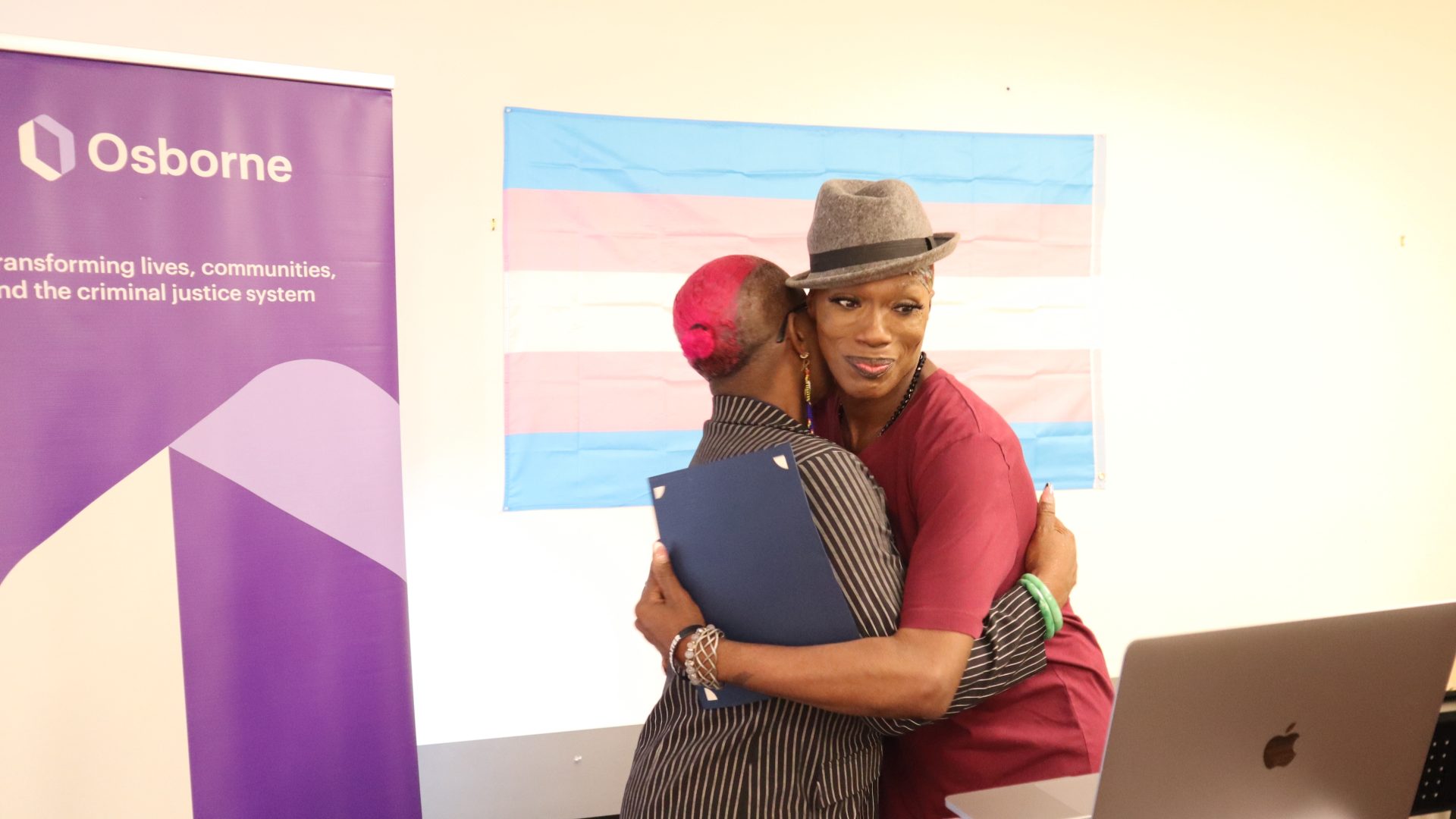 Kim Watson-Benjamin and Grace Detrevarah share a hug.