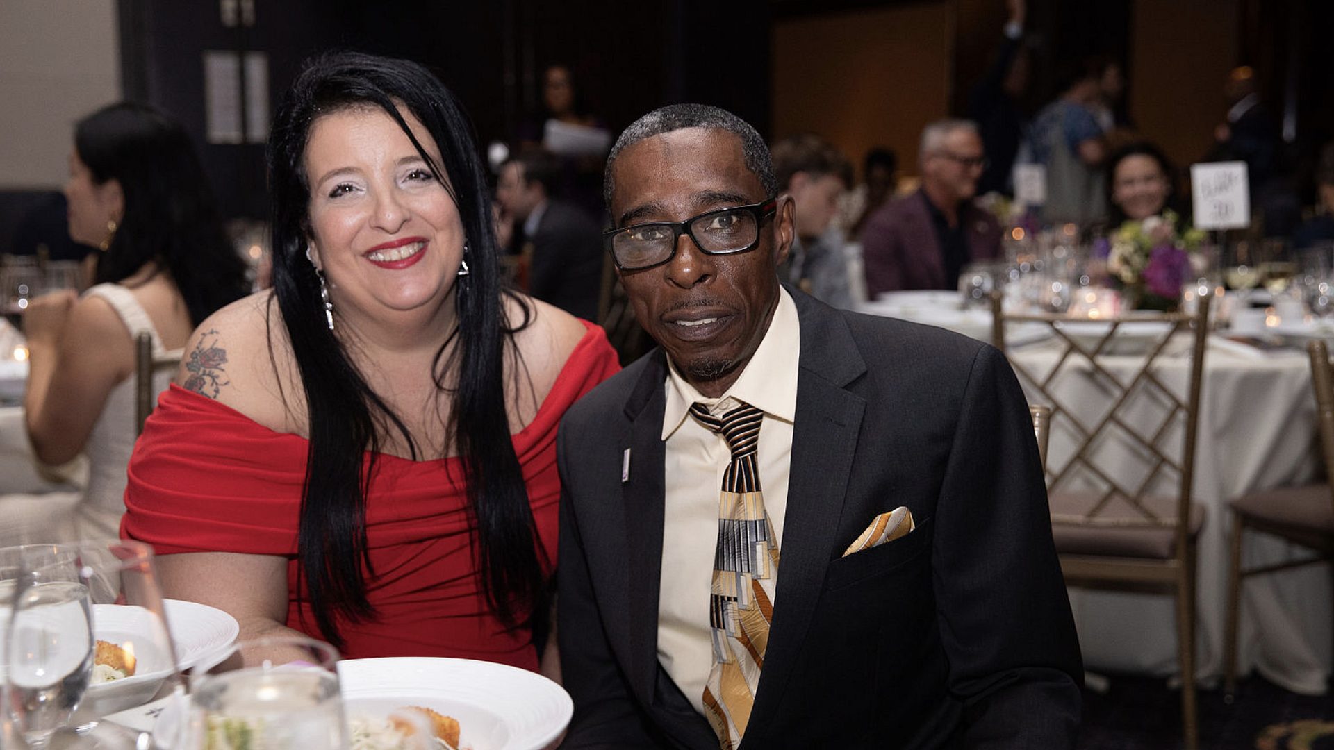 Left to right: Christina Green and Charles Bryant sit together at the table.