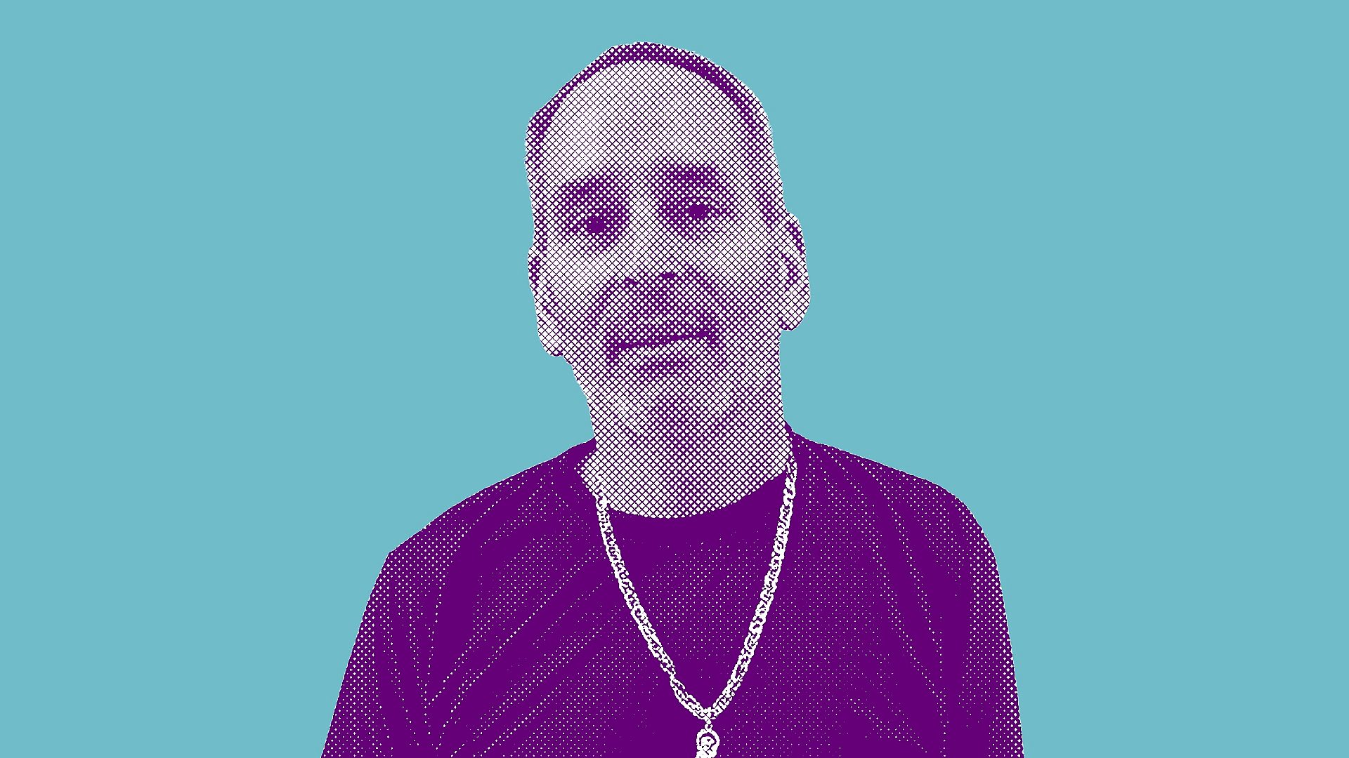 Osborne JMS looks at the camera. He has short hair and is wearing a black t-shirt and chain.